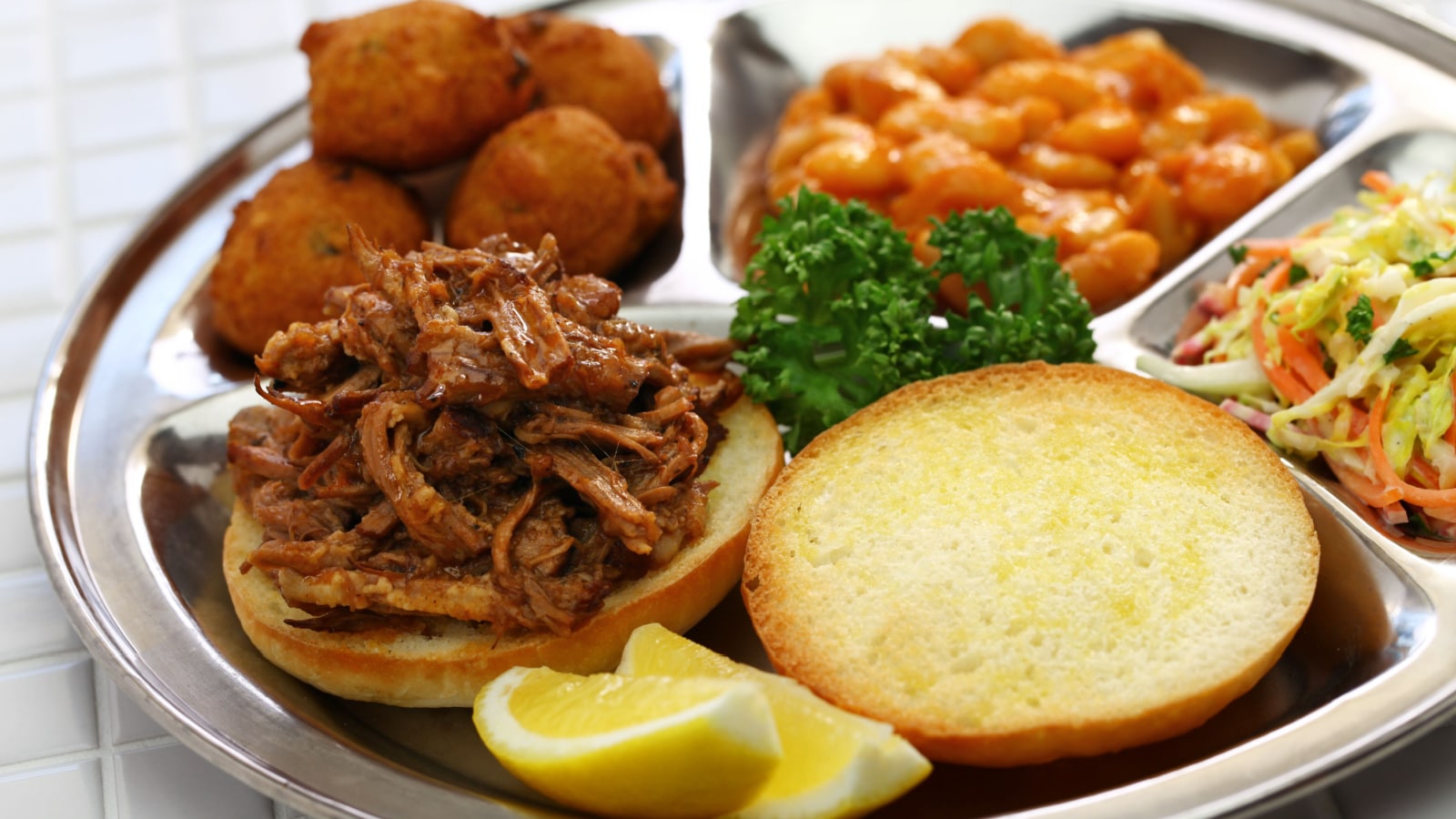North Carolina barbecue ; pulled pork, hush puppies, baked beans and coleslaw