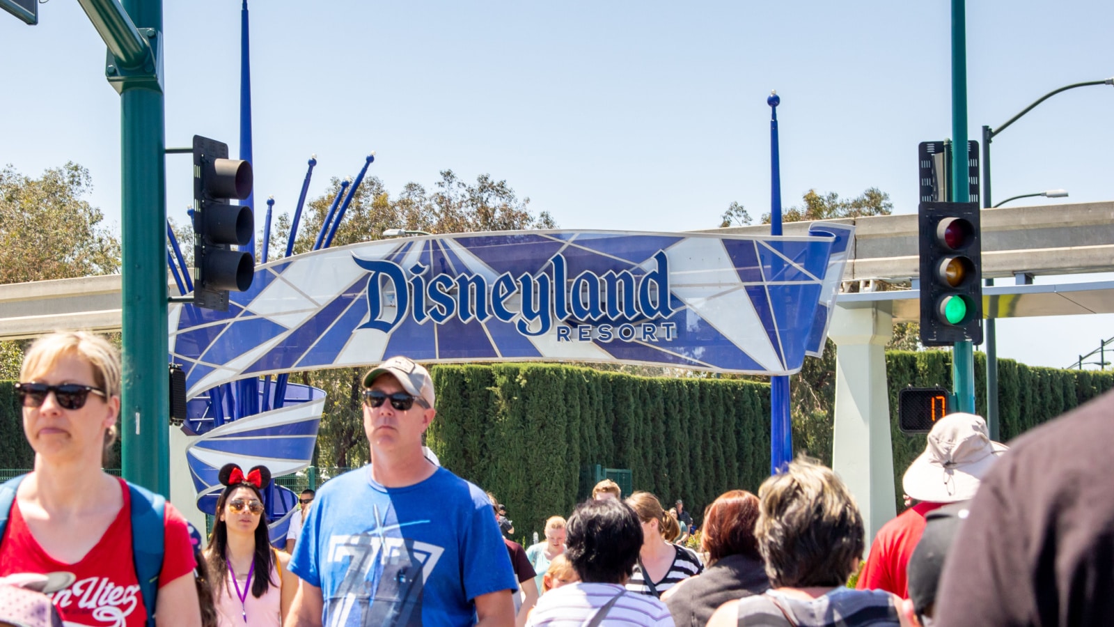 Anaheim, California/United States - 04/24/2019: Tourist walk across the street towards Disneyland theme park