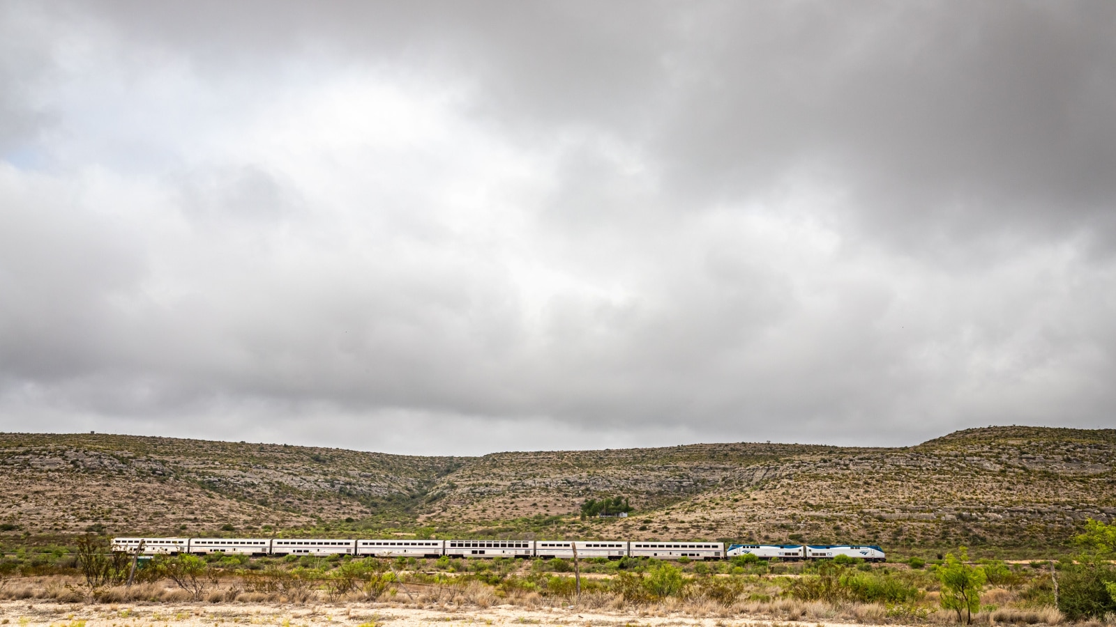 Terrell County, Texas / United States - June 2, 2020: The Amtrak Sunset Limited train travels through the desert near Sanderson, Texas.