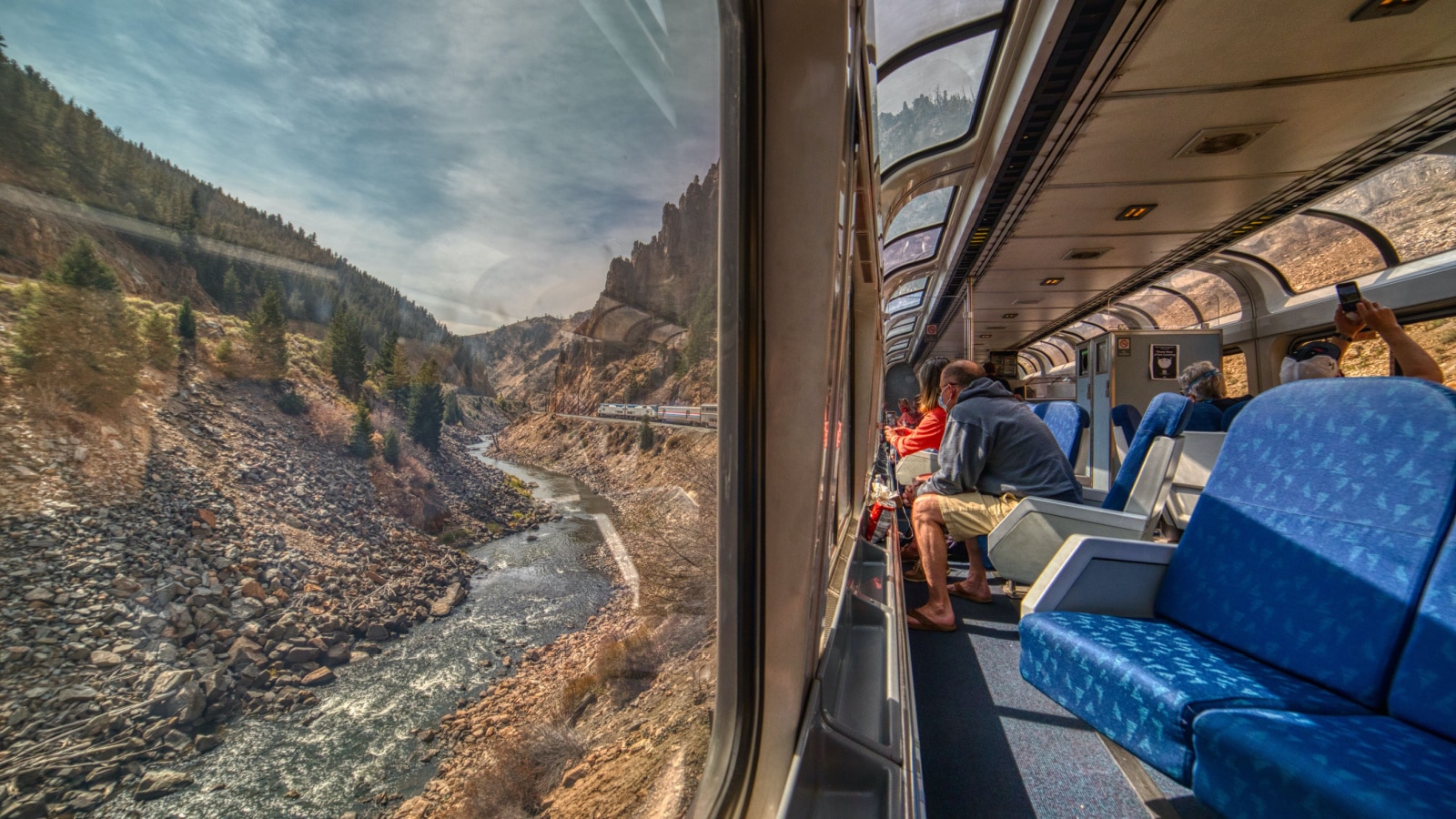 Denver, Colorado, USA 9-21-20 Amtrak Train crossing through the Colorado Rocky Mountains with peak Fall Colors in September