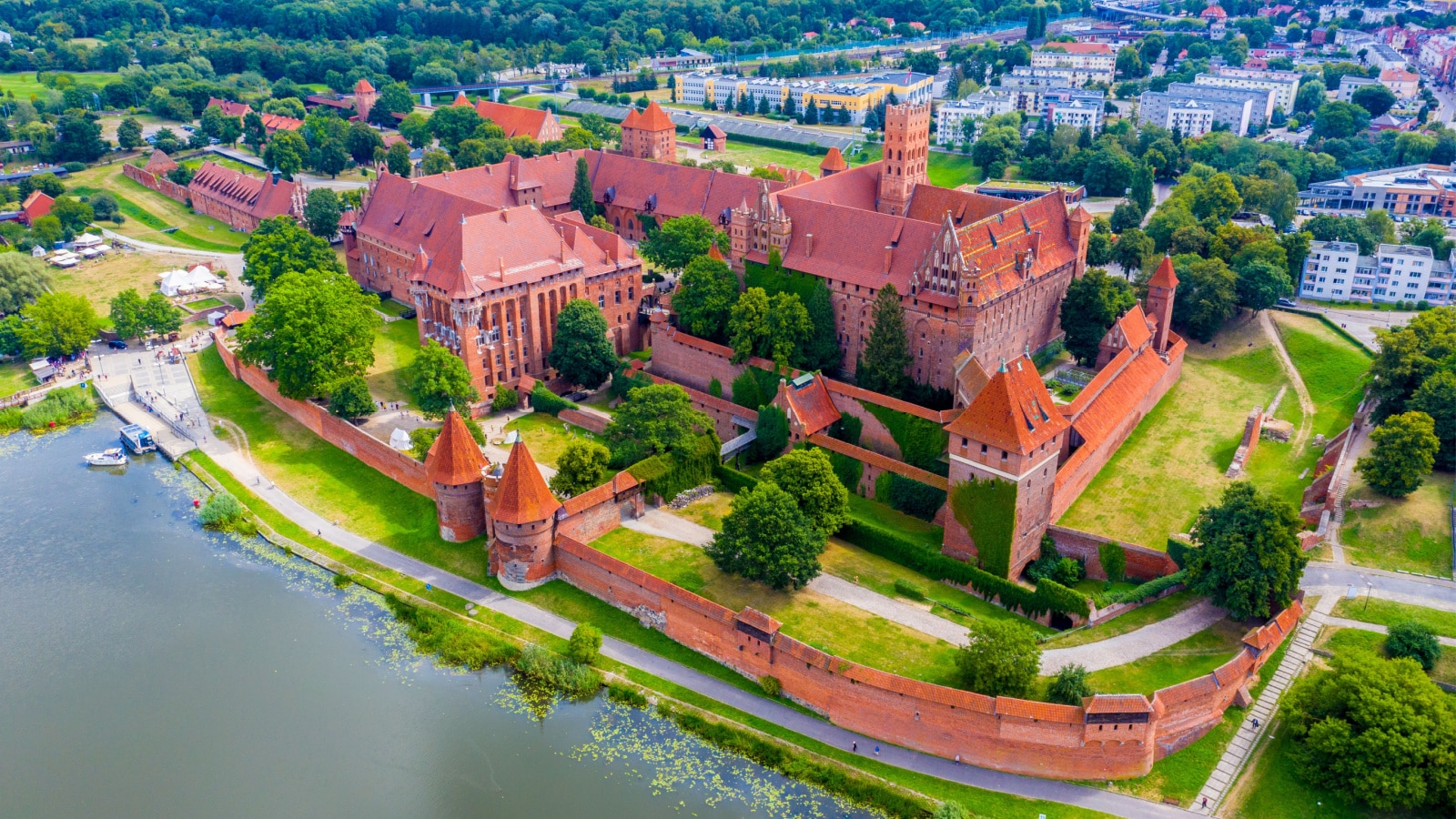 Aerial panoramic view of the gothic Grand Masters’ Palace in the High Castle part of the medieval Teutonic Order Castle by the Nogat river in Malbork, Poland