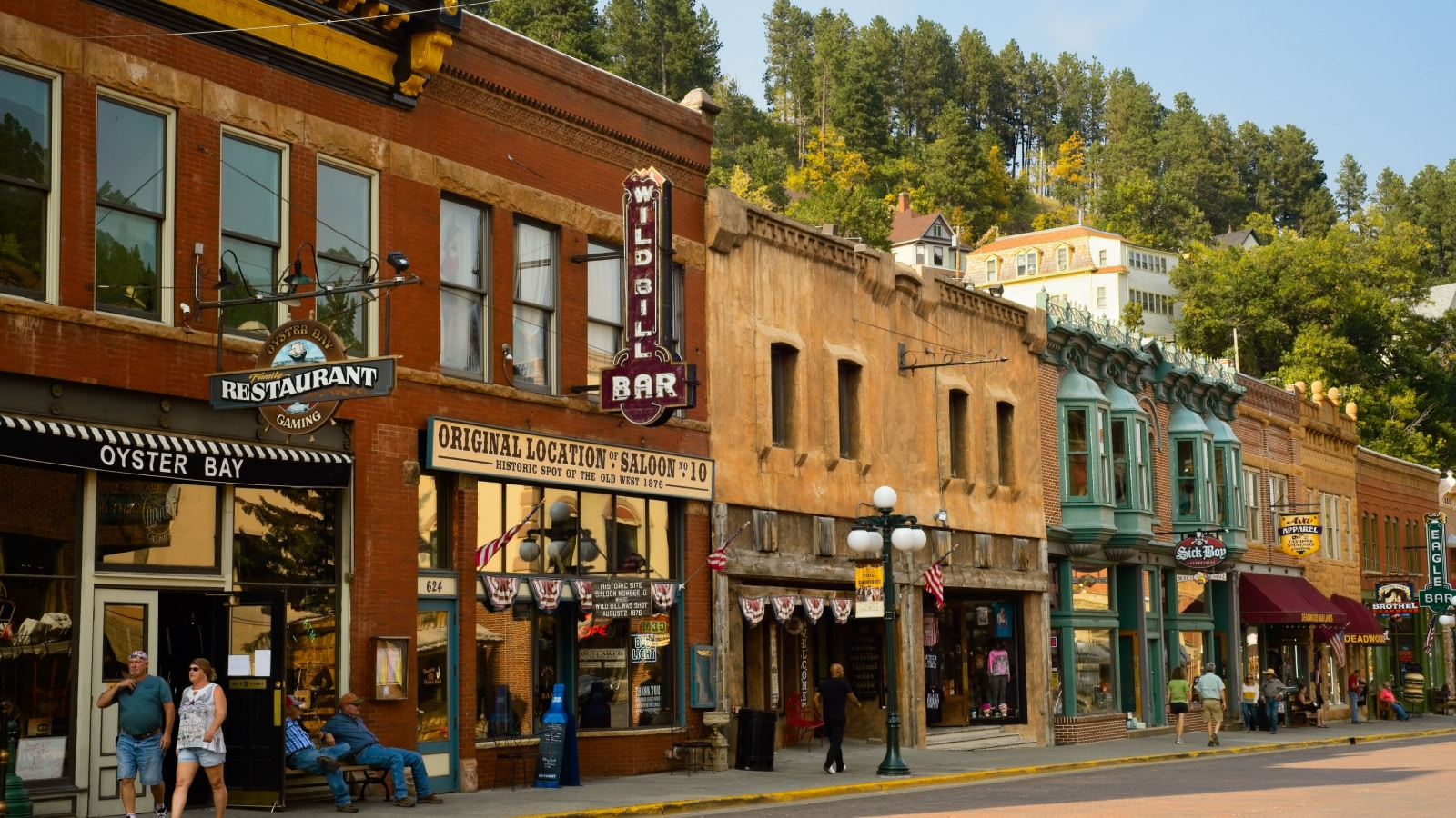 DEADWOOD, SD, USA - SEPTEMBER 15, 2020: Historic saloons, bars, and shops bring visitors to Main St. in this Black Hills gold rush town, famous for Wild Bill Hickok and Calamity Jane.