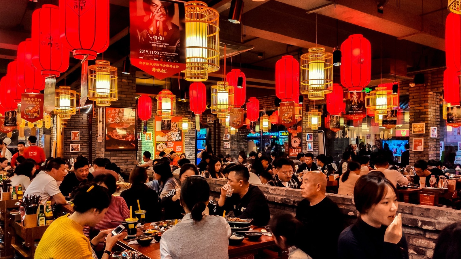 Chengdu, China - November 19th 2019: Bustling Sichuan Hotpot Restaurant with red Lanterns