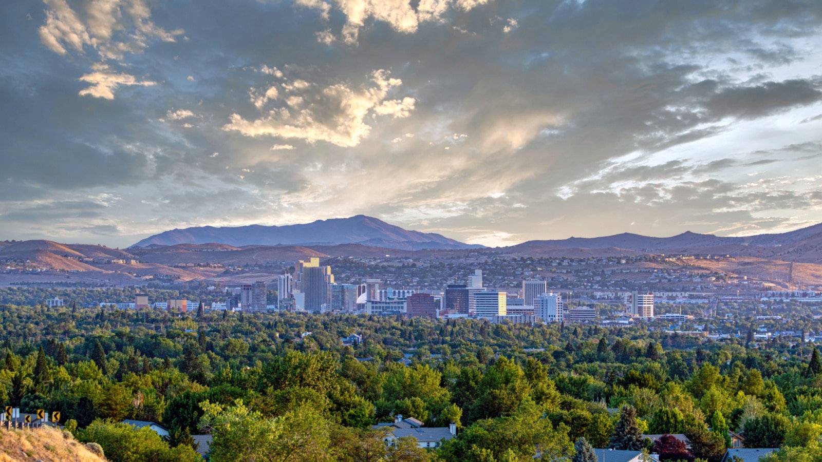 Cityscape of Reno Nevada with a dramatic sky.
