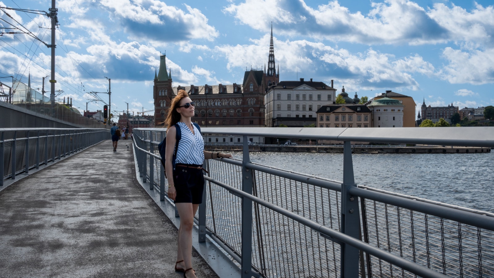 Beautiful Female Tourist enjoying the view of Stockholm city. Solo female traveler enjoying Stockholm city