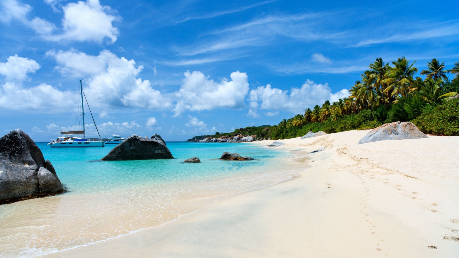 Stunning beach with white sand, unique huge granite boulders, turquoise ocean water and blue sky at Virgin Gorda, British Virgin Islands in Caribbean