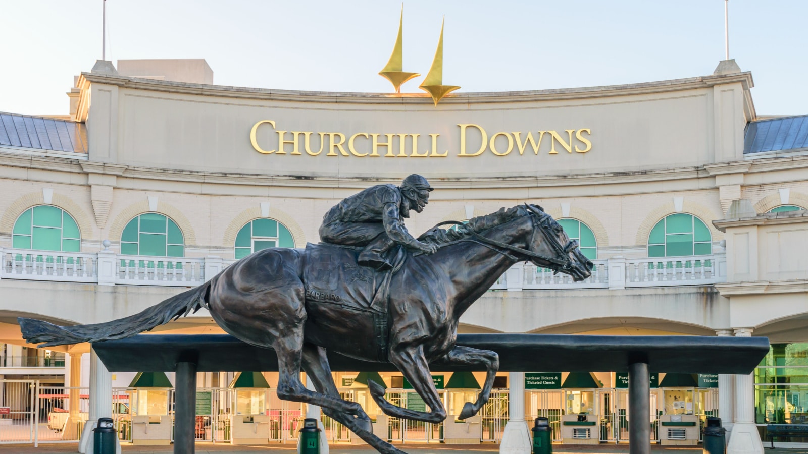 LOUISVILLE, KENTUCKY, USA - APRIL 3 2016: Entrance to Churchill Downs featuring a statue of 2006 Kentucky Derby Champion Barbaro.