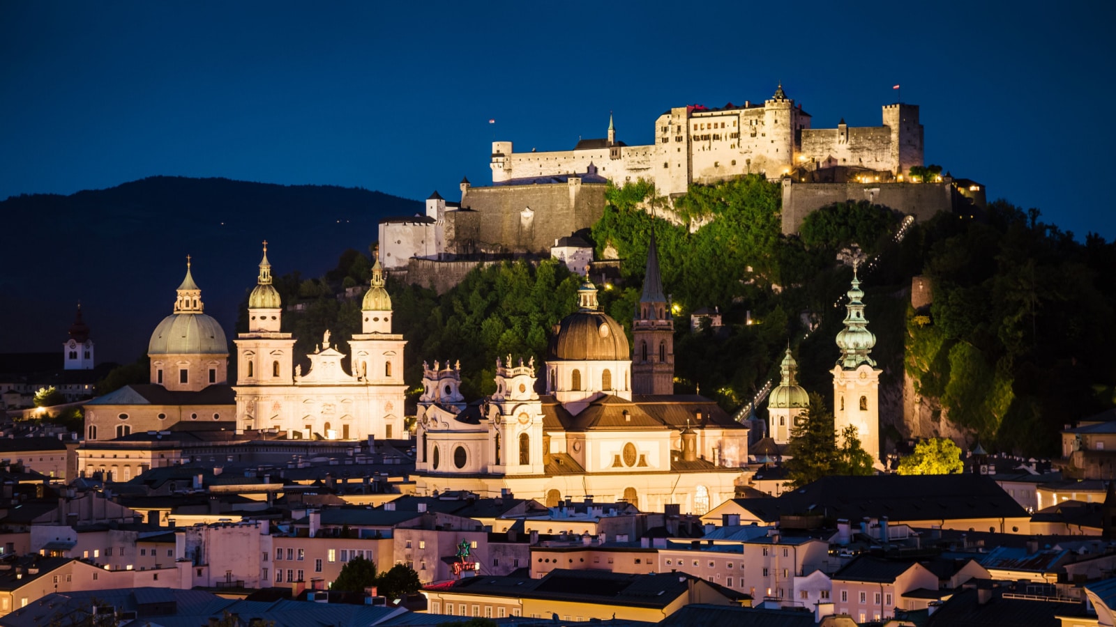 Great view from the top on an evening city shining in the lights. Dramatic scene. Location famous place (unesco heritage) Festung Hohensalzburg, Salzburger Land, Austria, Europe. Beauty world