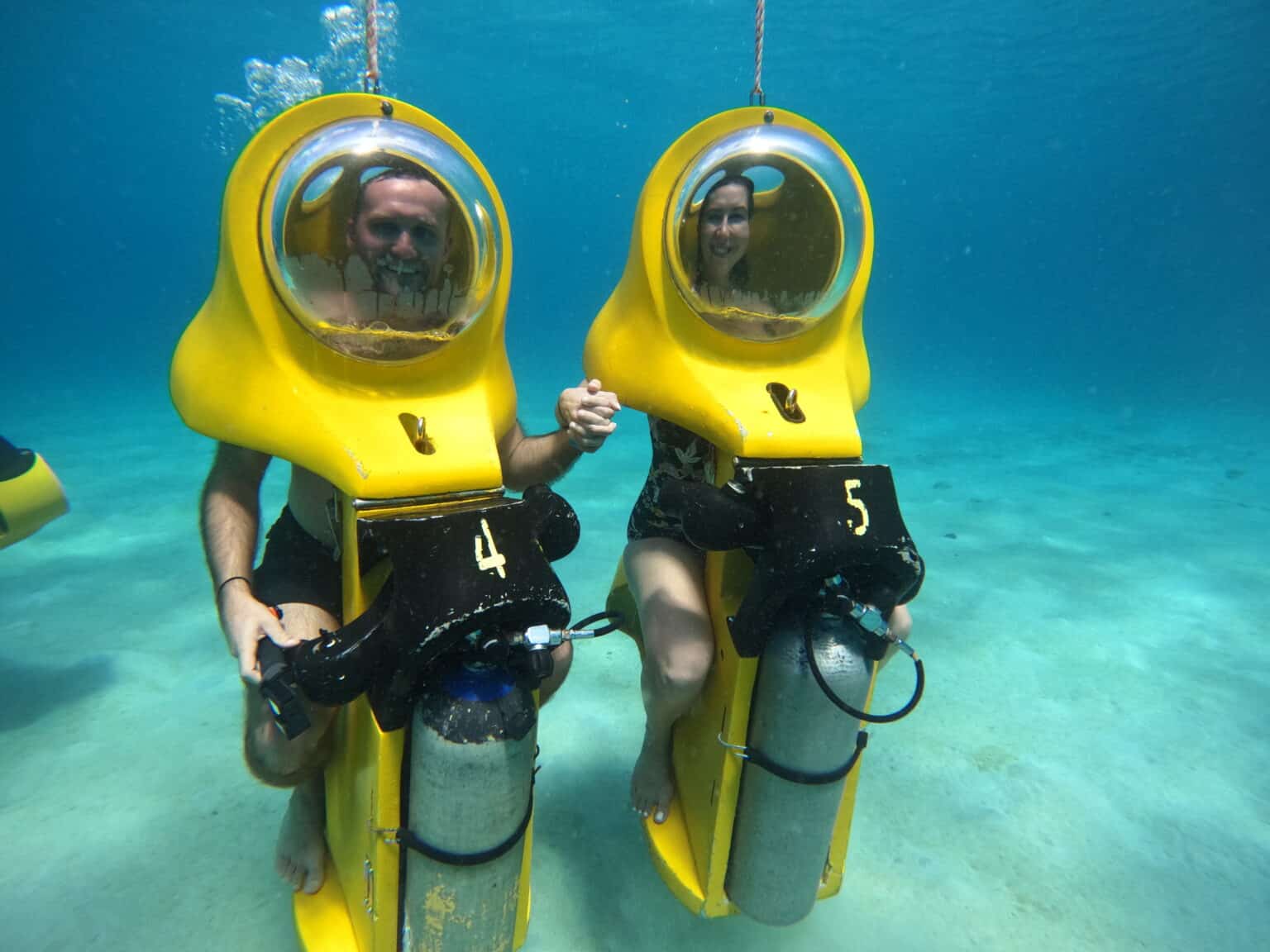 Holding hand underwater on our Aquafari tour in Curacao