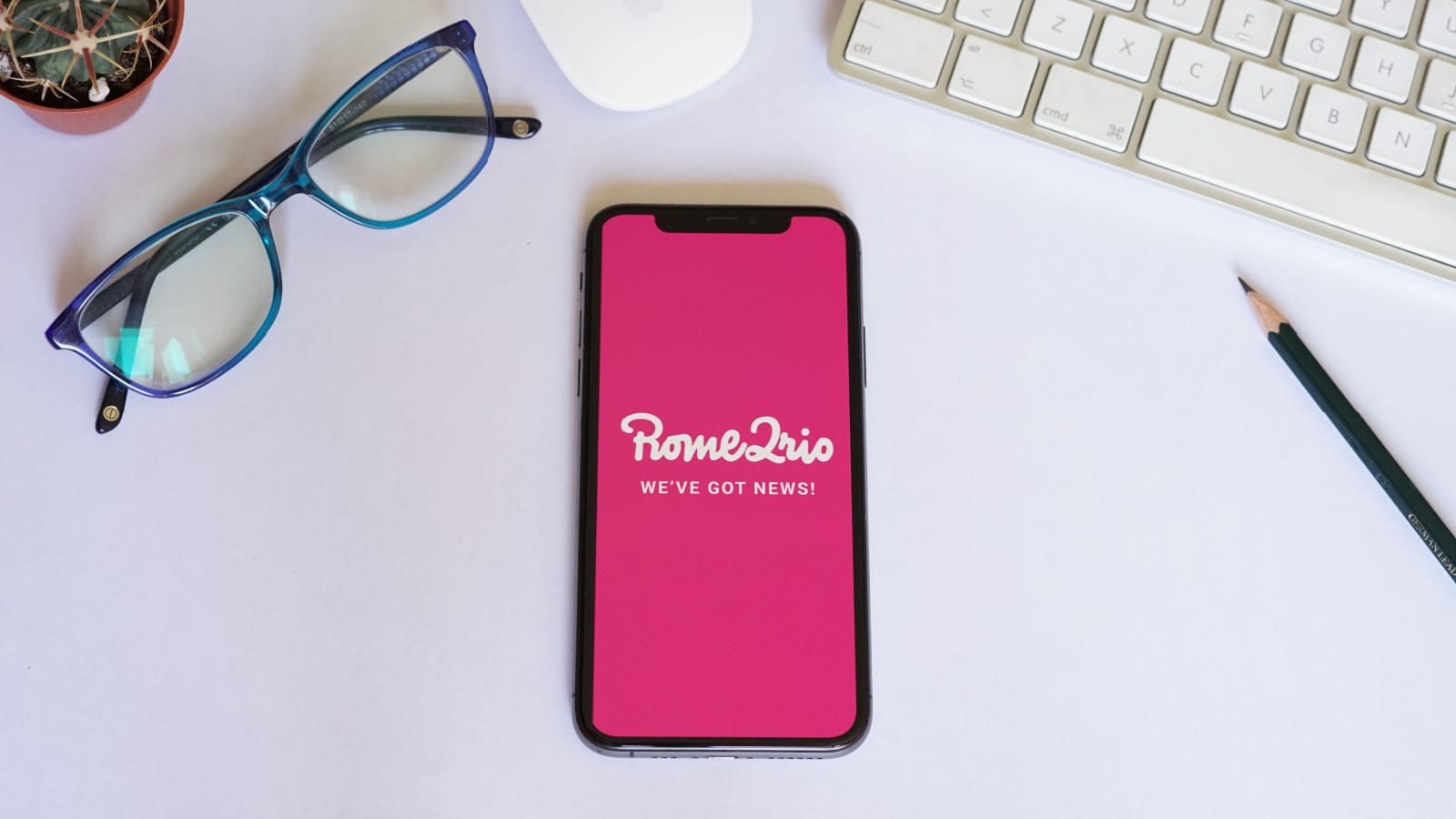 Barcelona, Spain - September 12, 2020; Rome2Rio Iphone Screen with Magic Mouse and Keyboard. Rome2rio is an online multimodal transport search engine. #Rome2rio