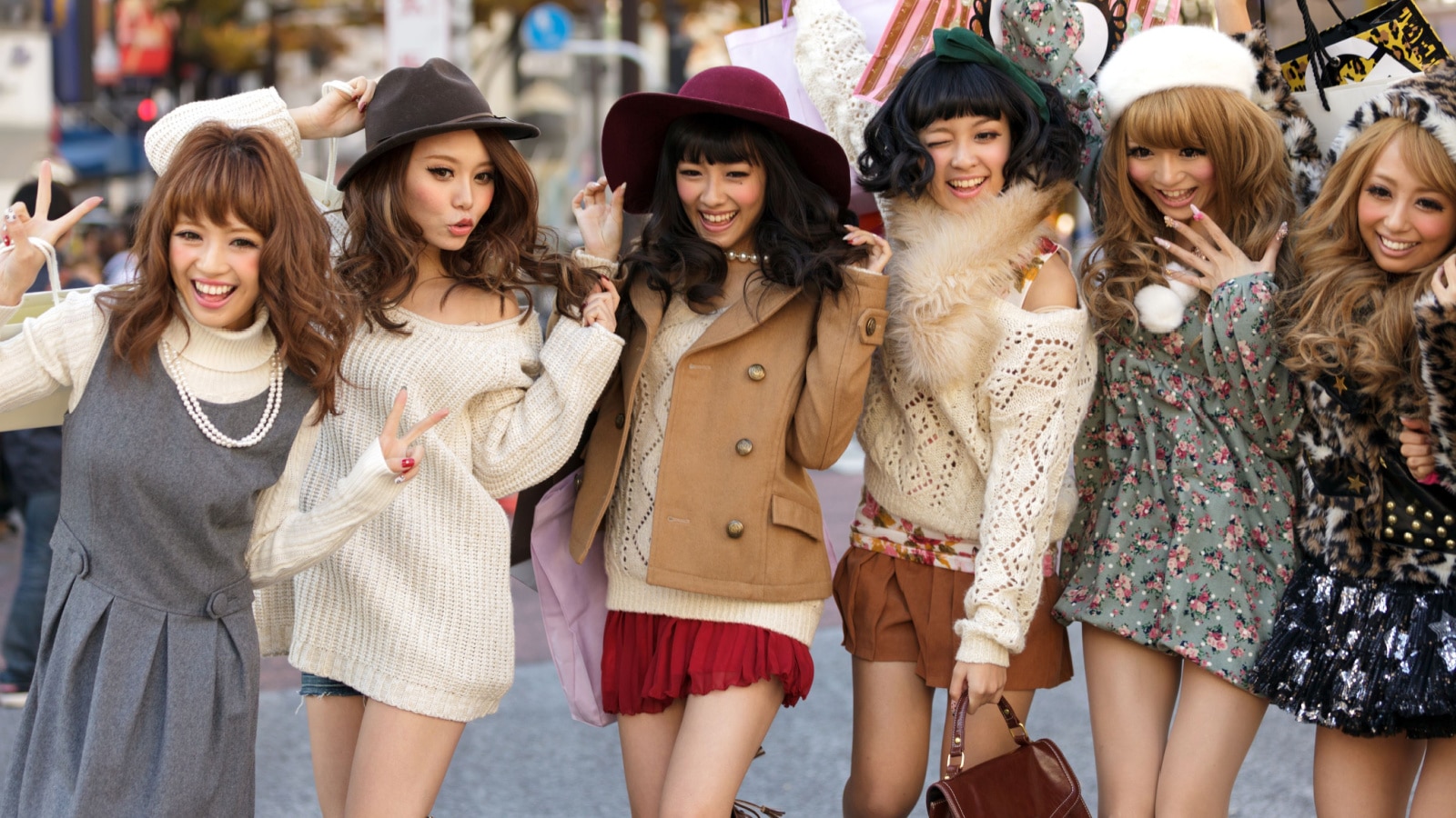 TOKYO,JAPAN, NOVEMBER 25, 2011 : A group of girls is posing in the middle of the street for fashion advertising in the street near the Shibuya crossroad in Tokyo, Japan.