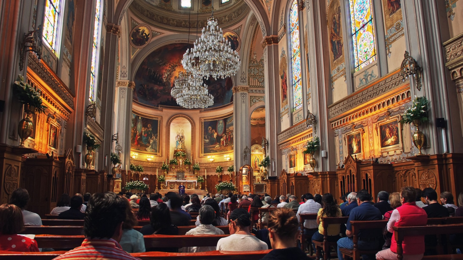 MEXICO CITY - MARCH 14, 2011: Interior of an unidentified church with people during the monday sermon