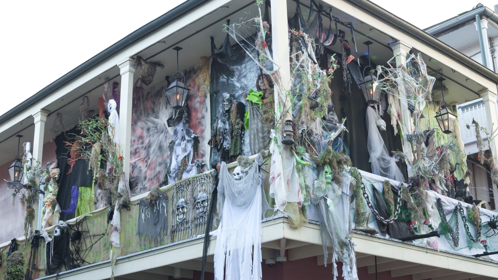 NEW ORLEANS, USA - OCTOBER 10, 2014: The upper balcony of a house on Bourbon Street is heavily decorated for Halloween with ghouls, ghosts and skulls.