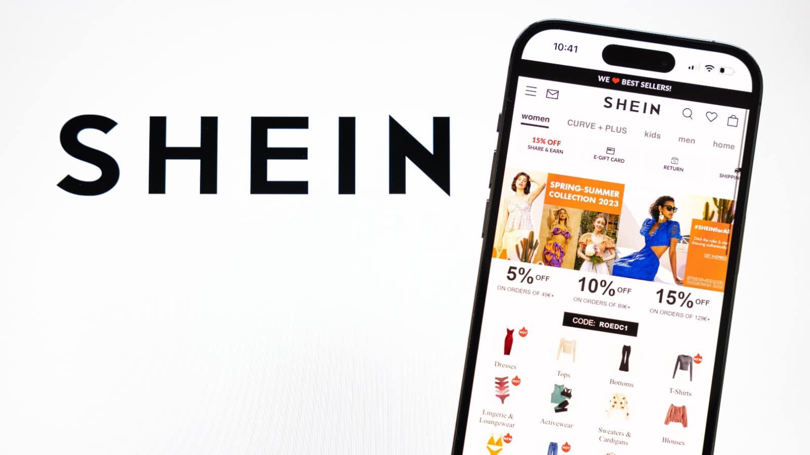 Madrid, Spain - February 23, 2023: Logo of fast fashion retailer Shein and it's online store on mobile phone.