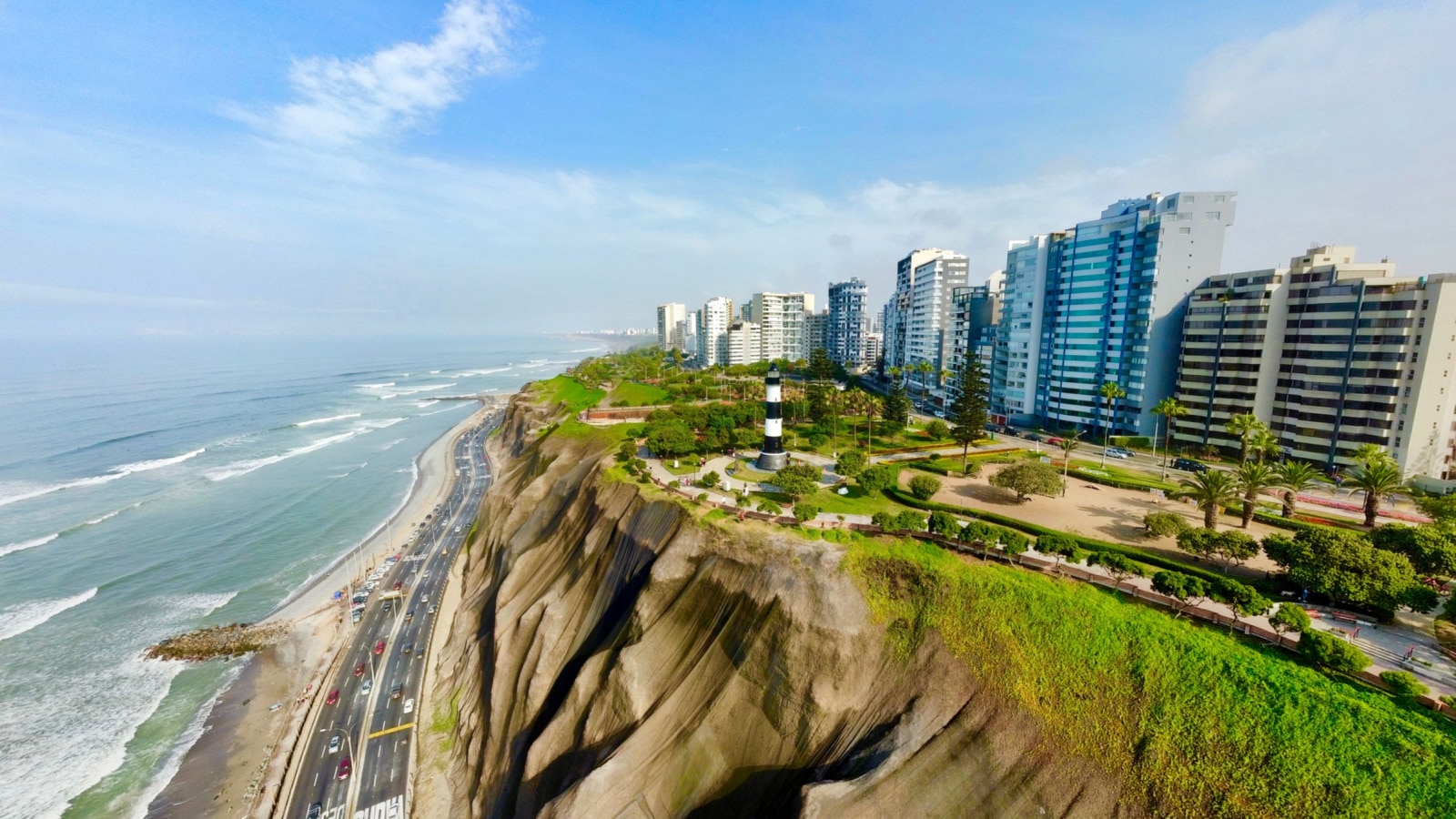 Miraflores, Lima, Peru. Aerial photo of Modern buildings on the top of the green hill next to the Pacific Ocean