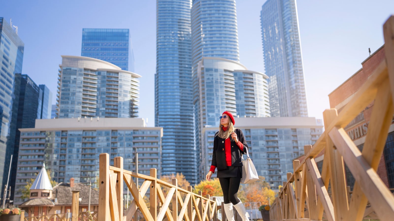 Business woman in city center looking at view of skyline skyscrapers in Toronto downtown , Canada. High quality photo