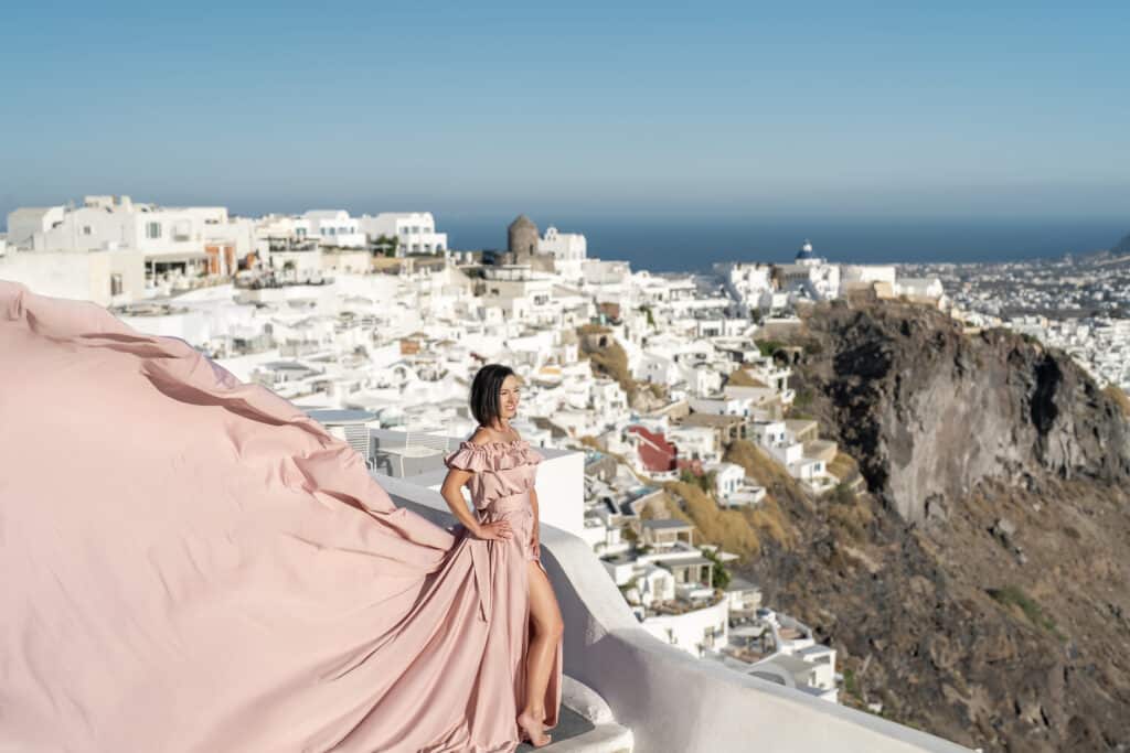 final edit of my flying dress photo with white building int he background in greece