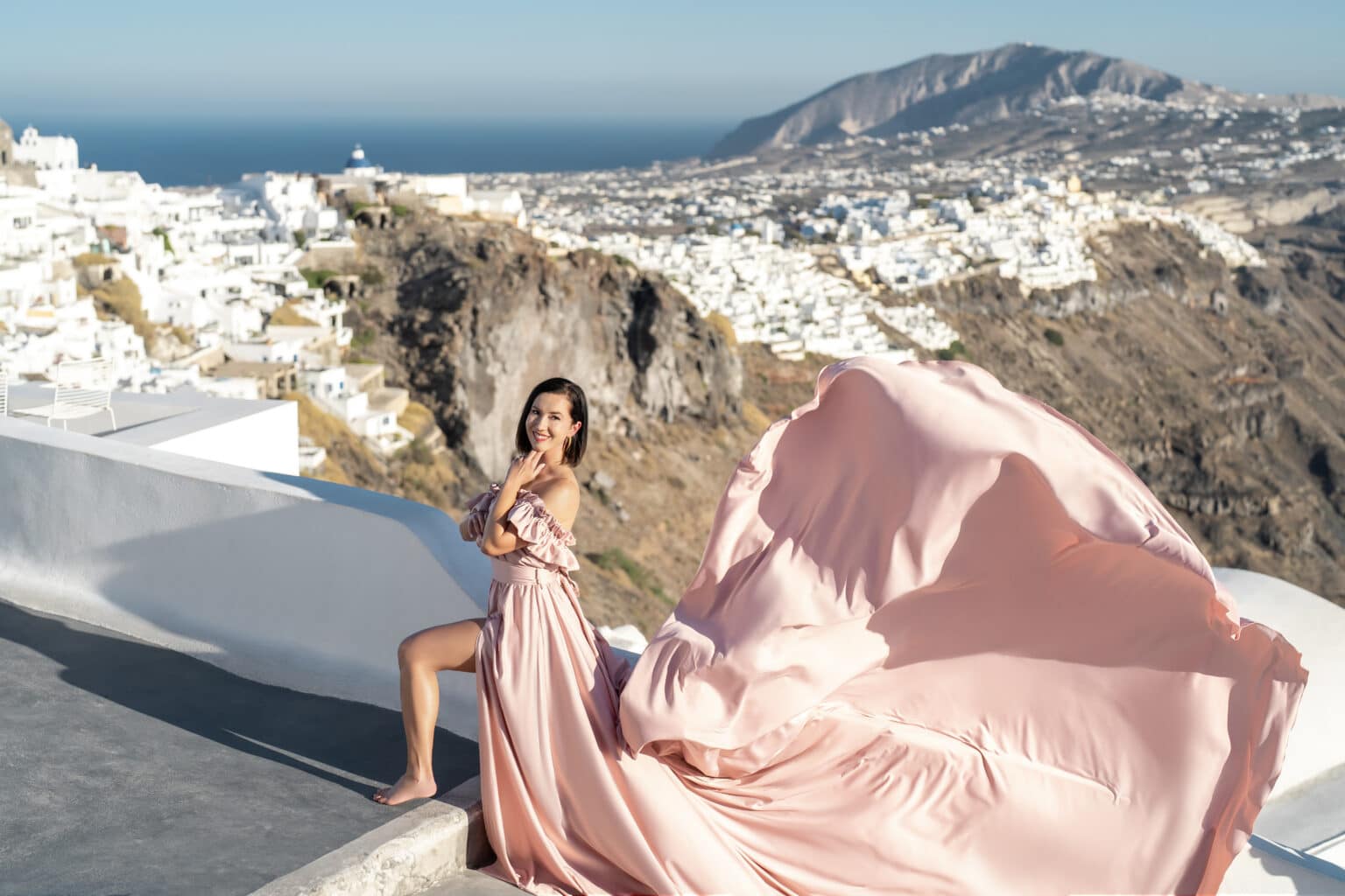 Lindsey posing for her flying dress photoshoot with her hand on her chin