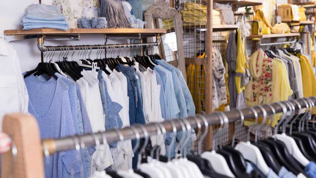 Image of different colored clothes in the modern shopping centre