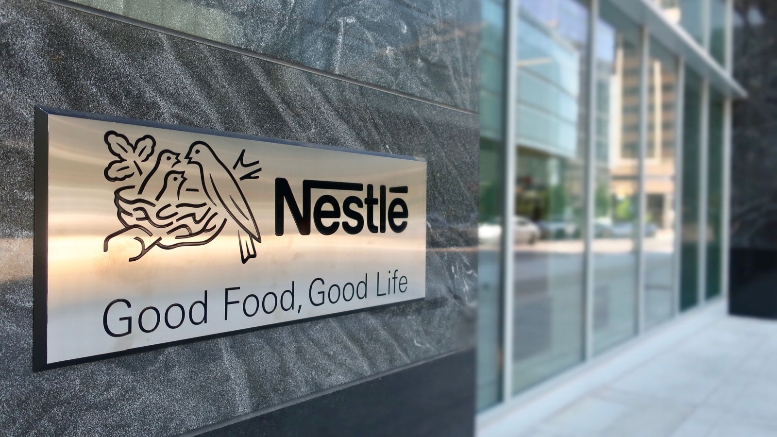 ARLINGTON, VA - MAY 19, 2019: NESTLE USA - entrance to headquarters building with sign. Nestlé is a Swiss multinational food company.