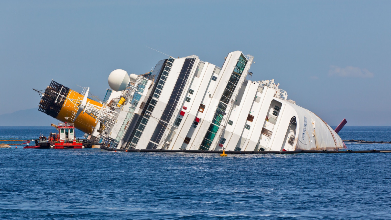 GIGLIO, ITALY - APRIL 28, 2012: Costa Concordia Cruise Ship at Italian Giglio Island Coastline after Shipwreck at January, 13, 2012.