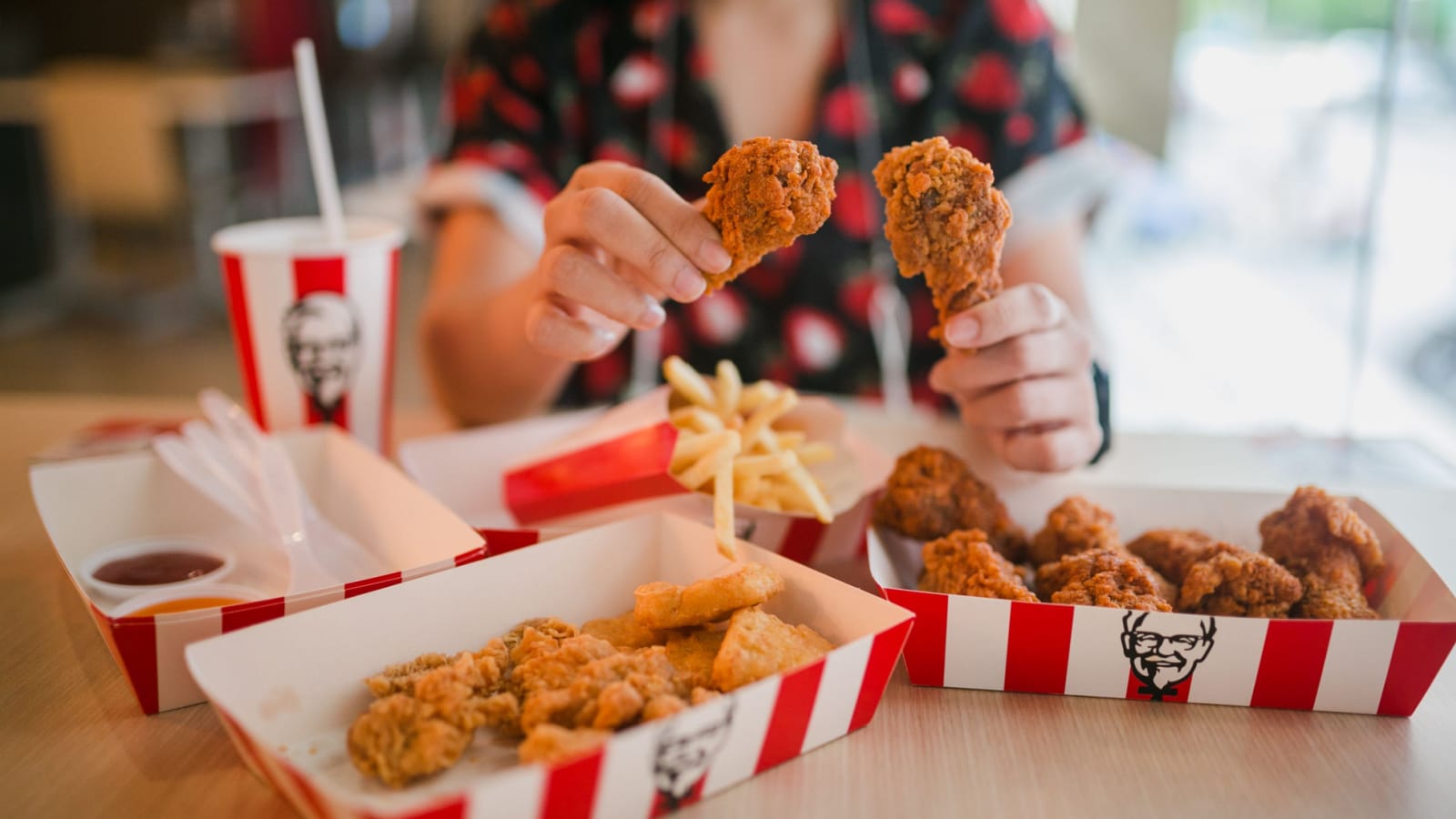 KFC is popular fast food chain known as Kentucky Fried Chicken.background of KFC restaurant.selective focus.THAILAND,20 May 2021.