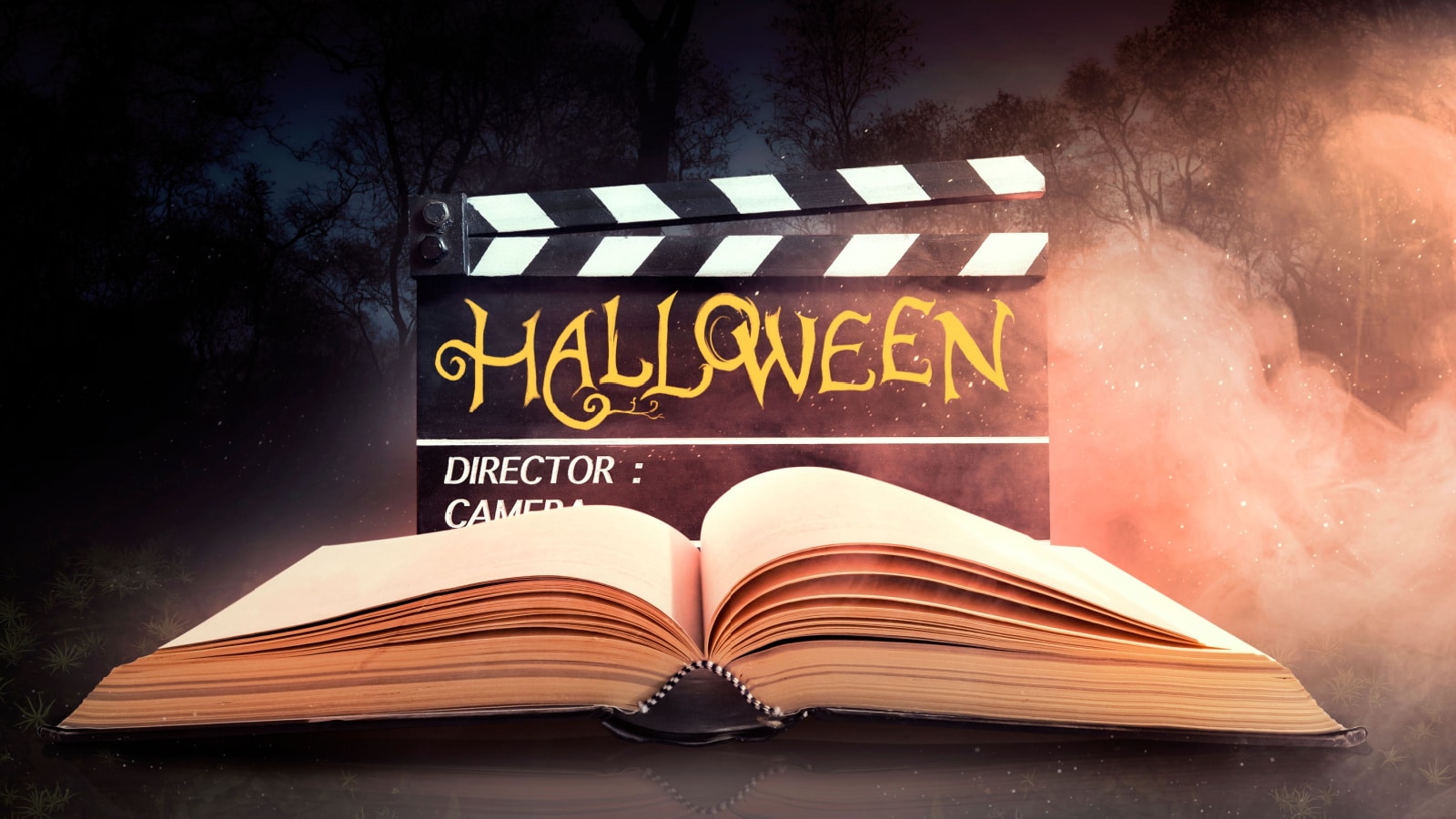 Halloween. Text title on film slate or movie clapperboard and old book in nightmare forest.
