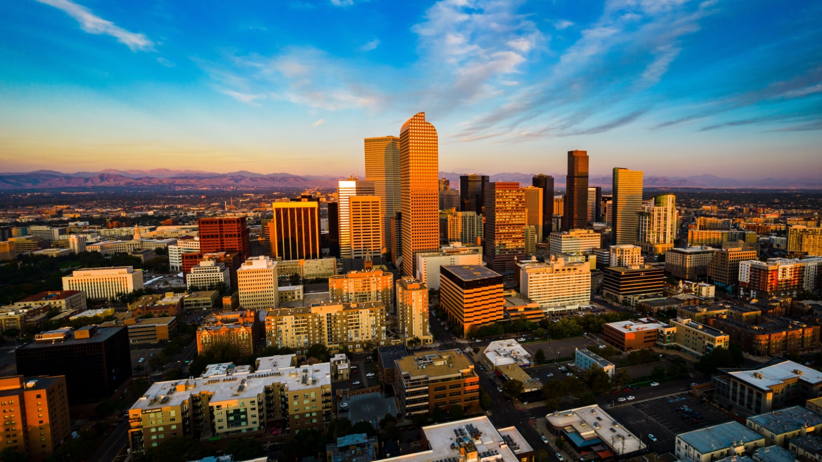 drone view above gorgeous golden hour sunrise in Downtown Denver , Colorado the Mile High City gorgeous Rocky Mountain capital city view