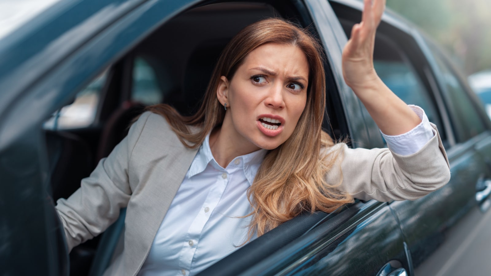 Road rage traffic jam concept. Woman is driving her car very aggressive