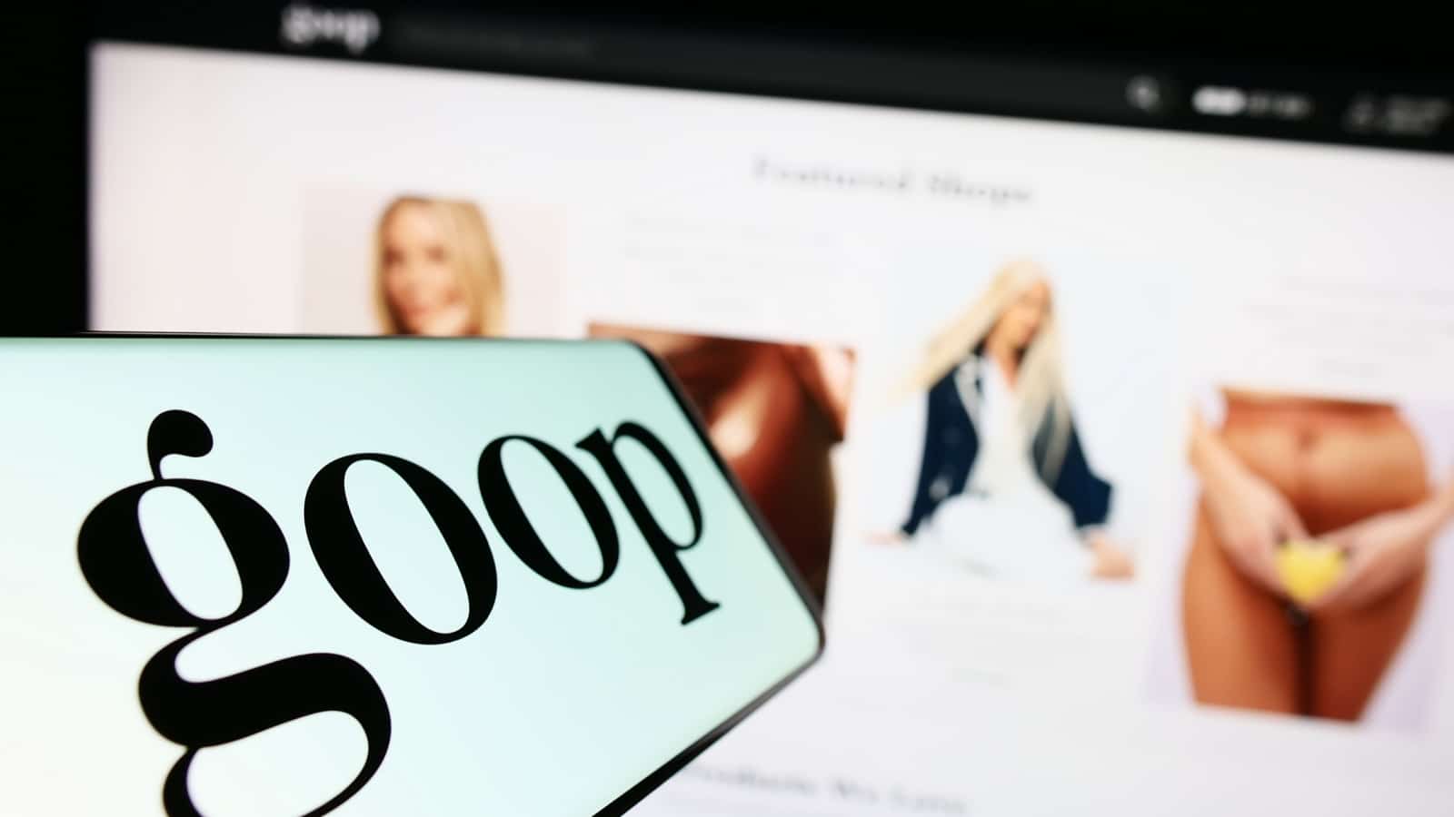 Stuttgart, Germany - 06-28-2023: Mobile phone with logo of US publishing and e-commerce company Goop Inc. on screen in front of website. Focus on center-left of phone display. Unmodified photo.