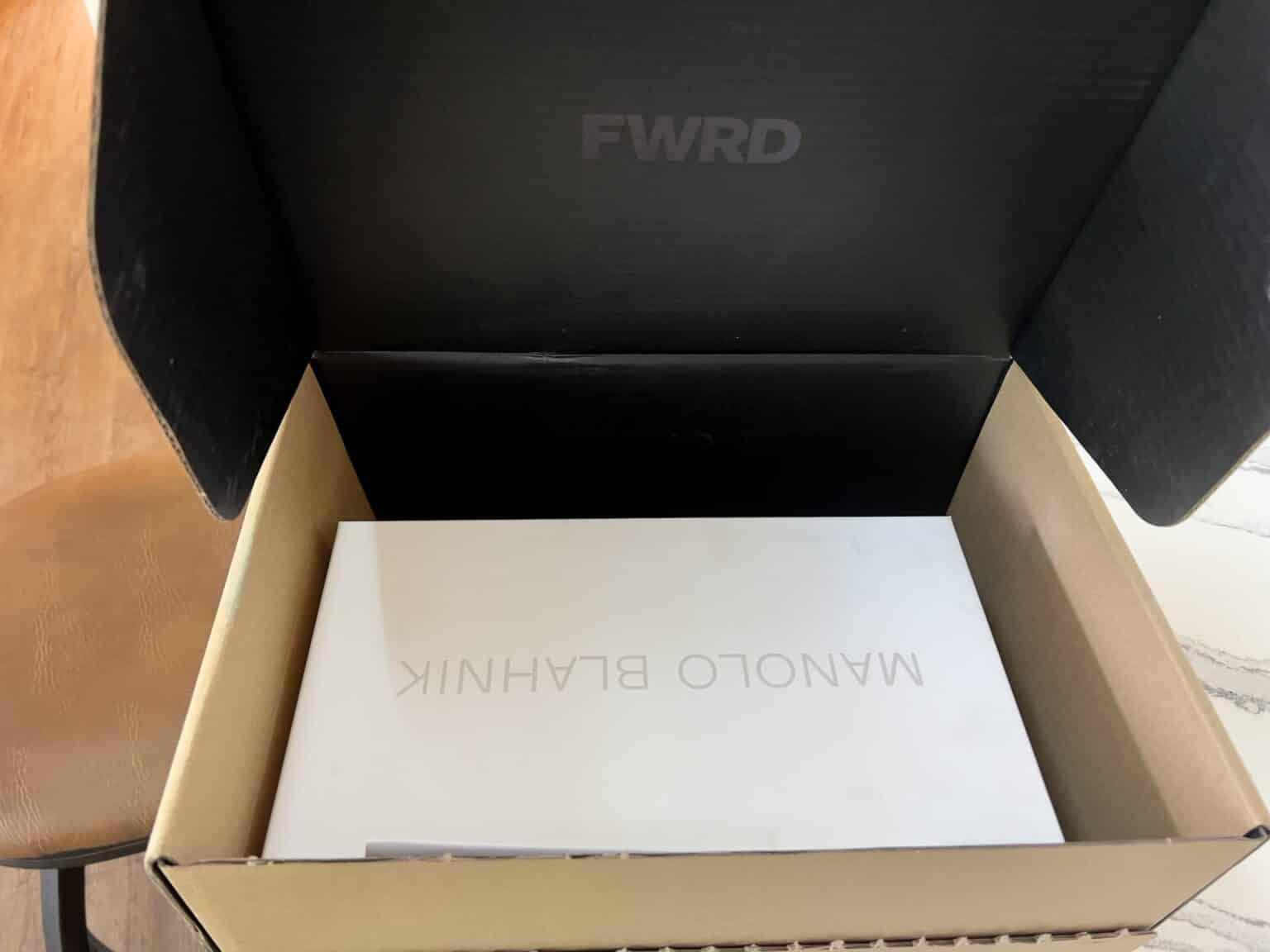 My order from FWRD featuring a white Manolo Blahnik shoe box inside a black FWRD box 