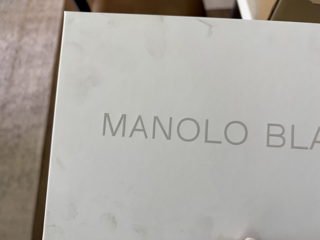 White Manolo box with black finger print smudges