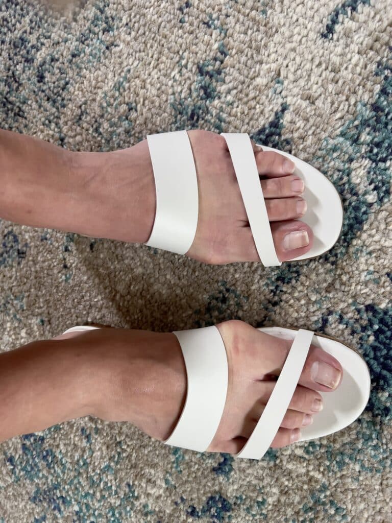 wearing the sandals they are too narrow and too long