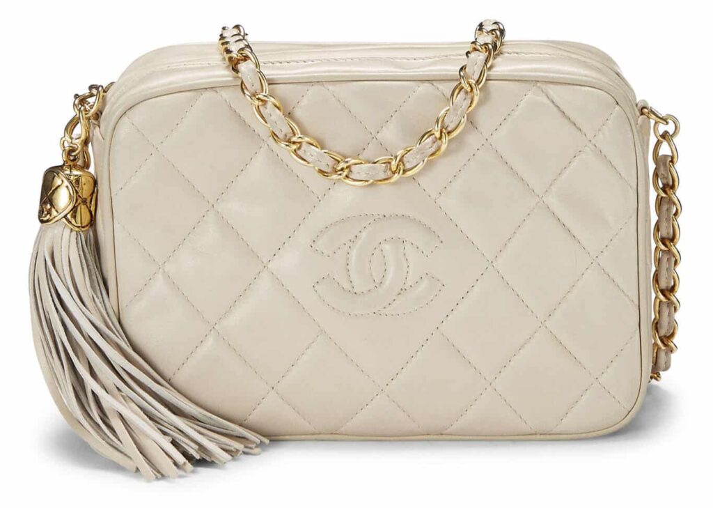 CHANEL
BEIGE LAMBSKIN DIAMOND 'CC' CAMERA BAG MINI