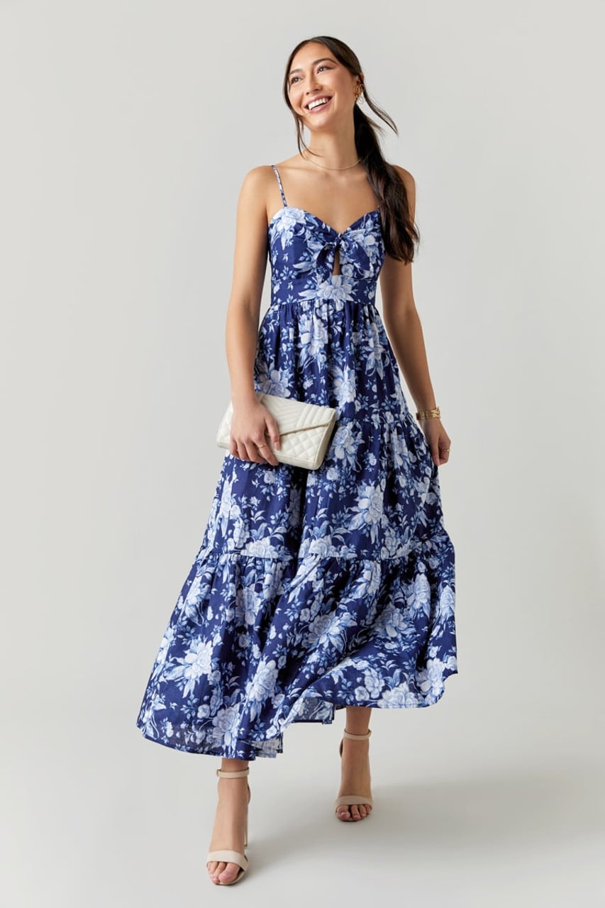 Avril Front Tie Floral Maxi Dress in Navy paired with white envelope clutch and strappy heels