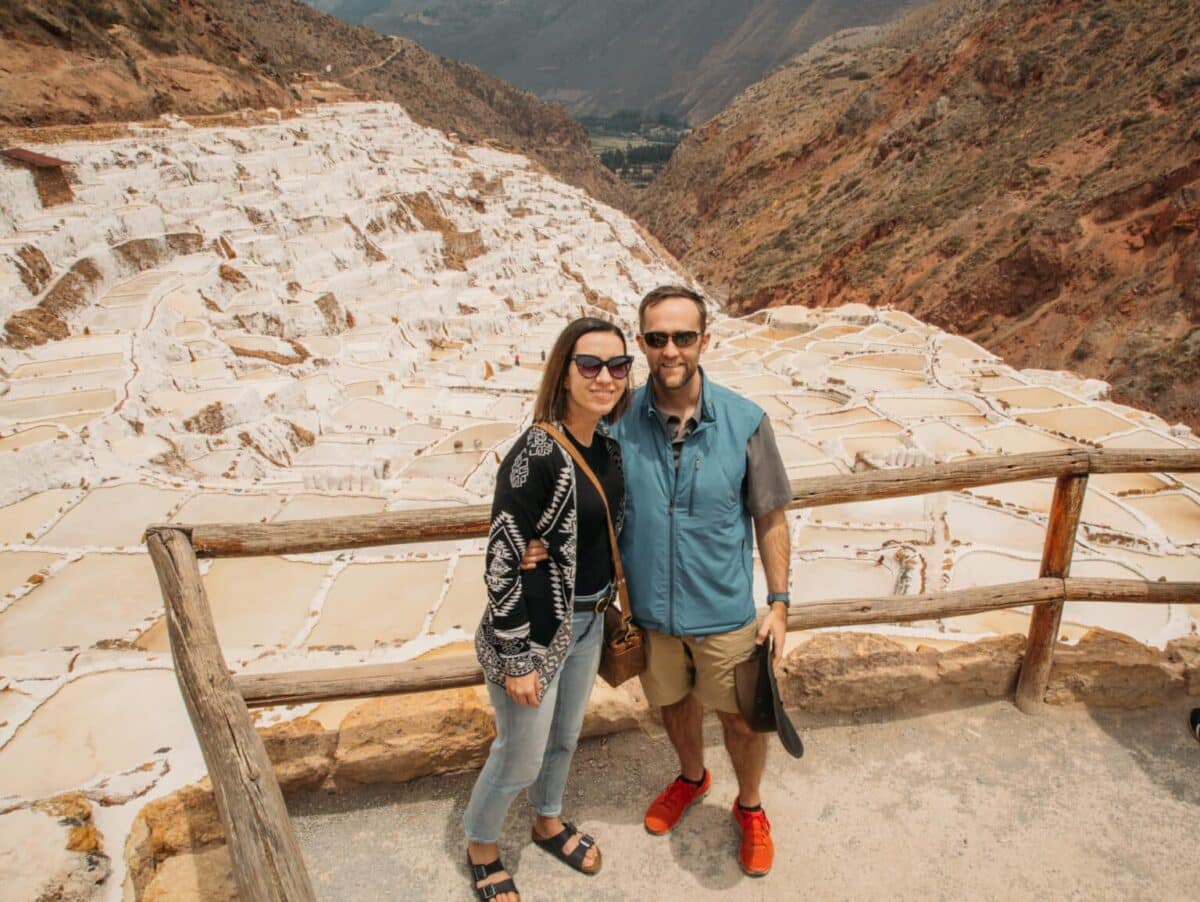 Lindsey and Zac standing in front of the Peruvian Salt mines.