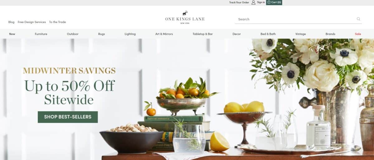 One Kings Lane website with 50% off sitewide sale and fruit and floral table decor