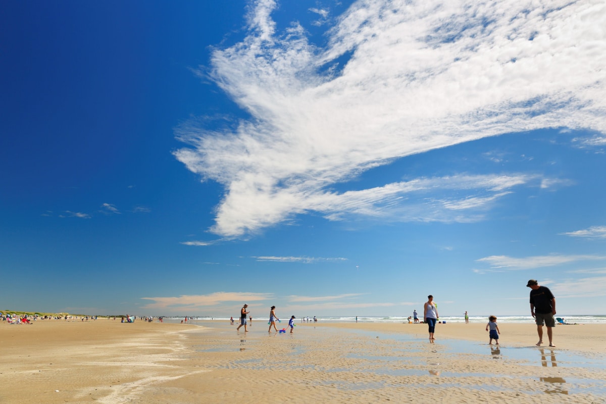 Ogunquit, Maine - May 25, 2019: Tourists walking on the Ogunquit Beach, Maine. Ogunquit beach is one of the best beaches in New England.