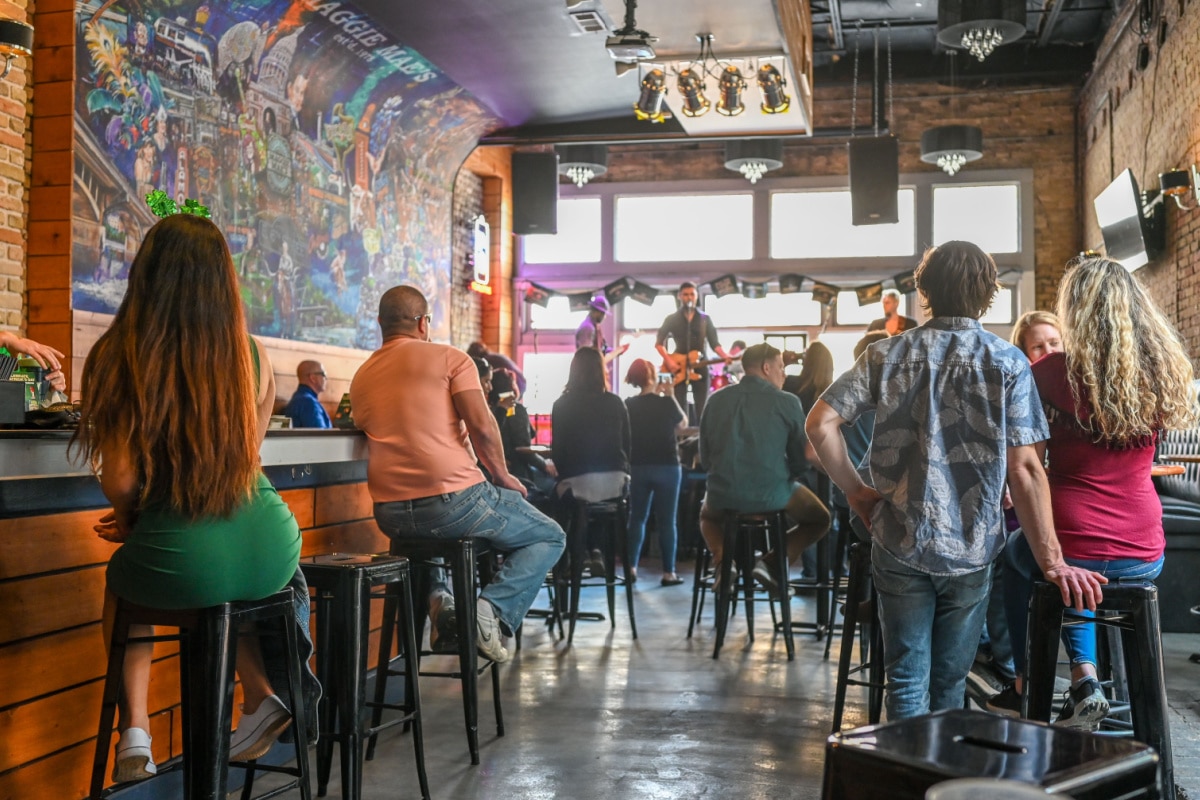 AUSTIN, TEXAS, USA - MARCH 17, 2019: Music bar on Sixth Street in Austin Texas during St Patricks day in March 2019. This historic street is famous for its live music bars.