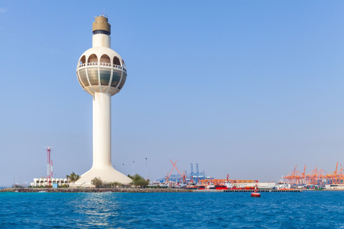 White lighthouse and traffic control tower as a symbol of the port of Jeddah, Saudi Arabia