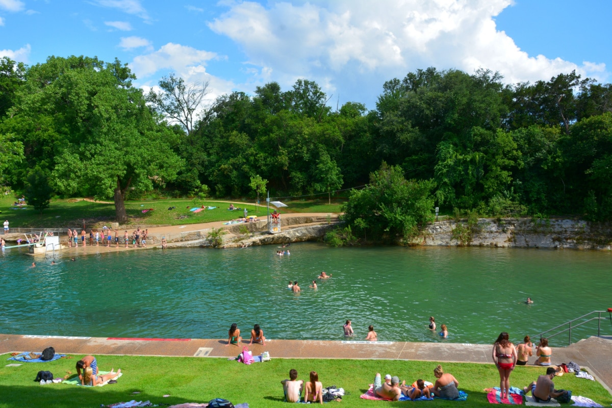 AUSTIN, TEXAS, USA - JUNE 12, 2015. Barton Springs Pool in Austin, TX, with people.