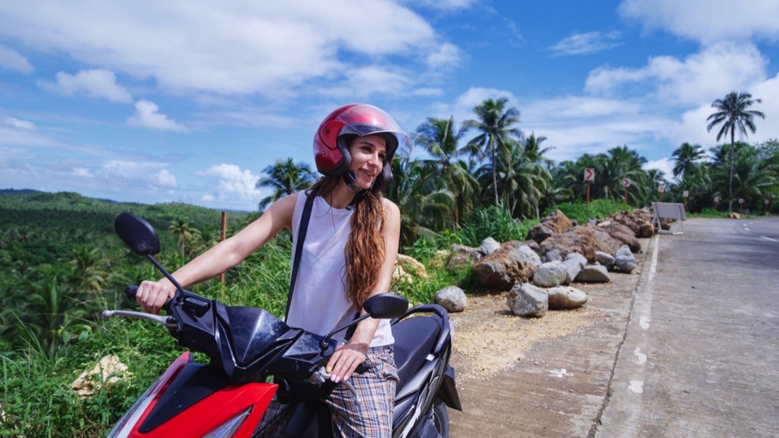 Woman riding scooter in Vietnam