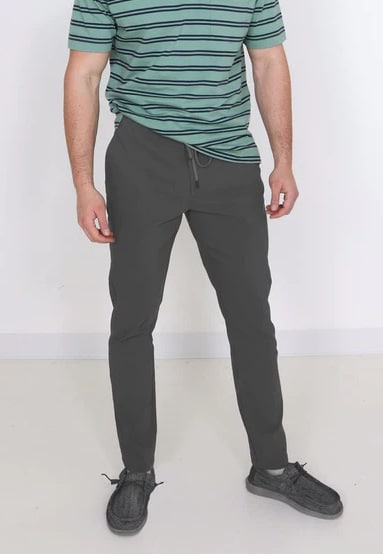 Copper & Oak Elastic File Tech Jogger Pants for Men in Forge Grey Paired with a pair of Hey Dude grey shoes