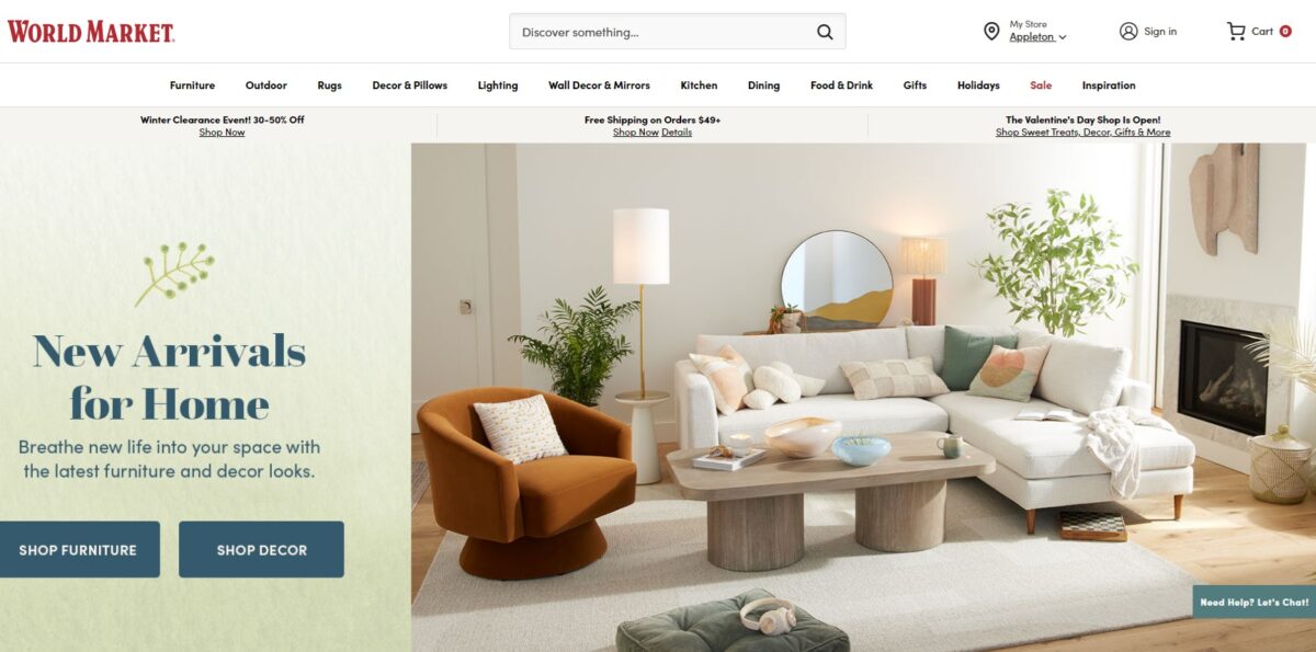 world market home page feautirng a white sectional sofa, orange accent chair and fireplace