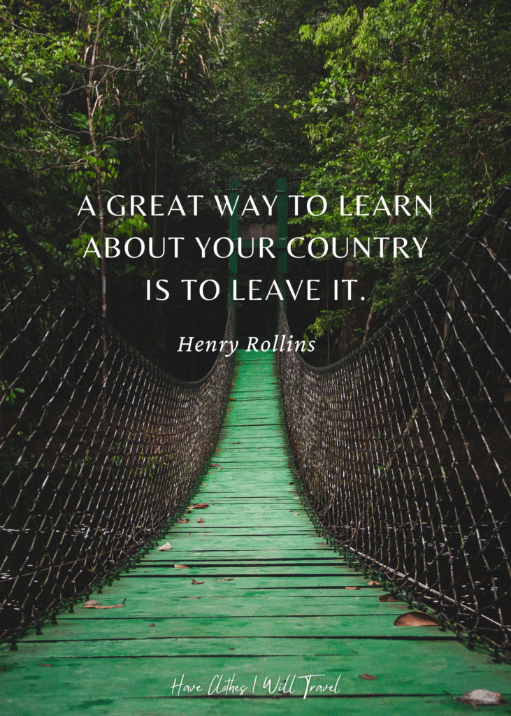 Portrait shot of a hanging bridge with green paint flooring as background for a travel quote by Henry Rollins
