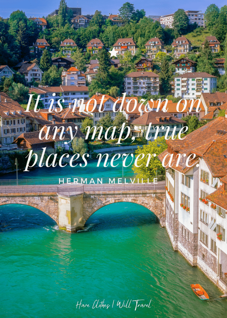 Picturesque line of houses and hotels by the water in Switzerland as background for a travel quote by Herman Melville