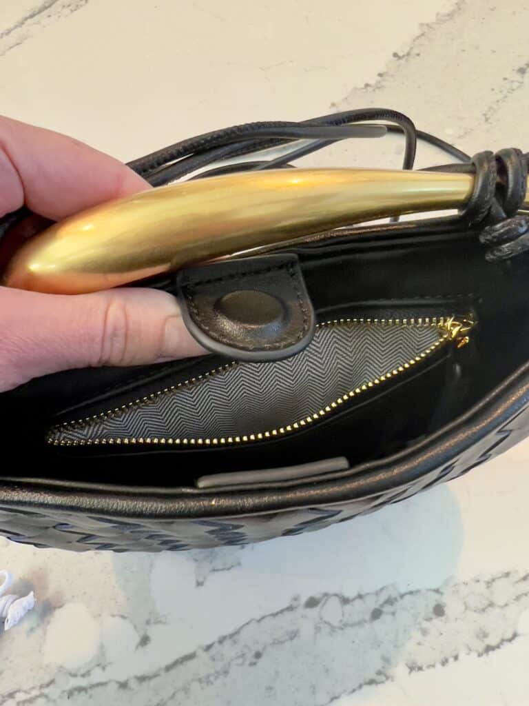 A zipper compartment in the fake bag