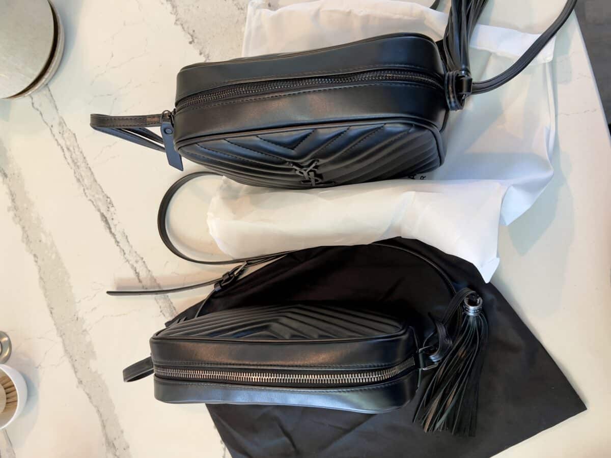 Two black handbags side by side on a white countrer top