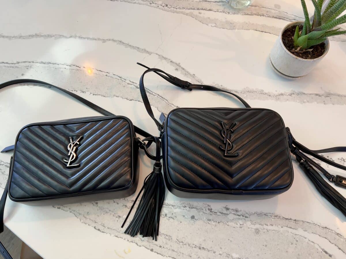 2 handbags laying next to each other on a counter top