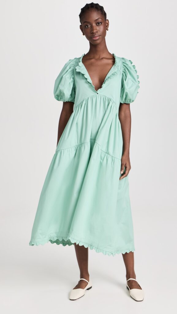 Model Wearing one of the Best Cottagecore Dresses - a Sage Green Leana Midi Dress from SHOPBOP